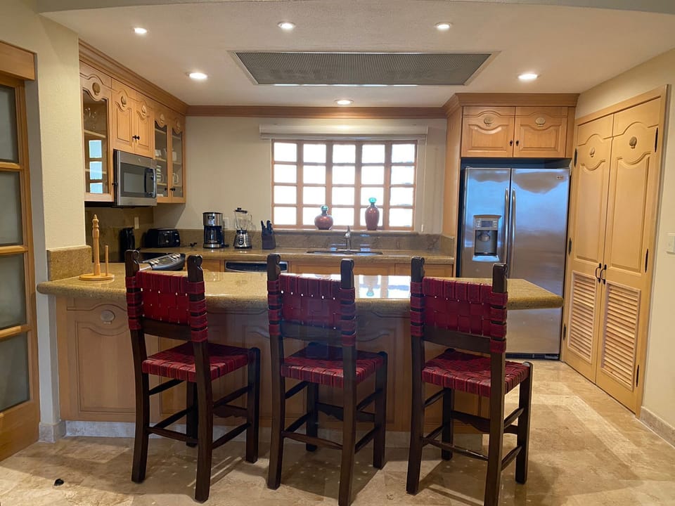 Kitchen showing breakfast bar