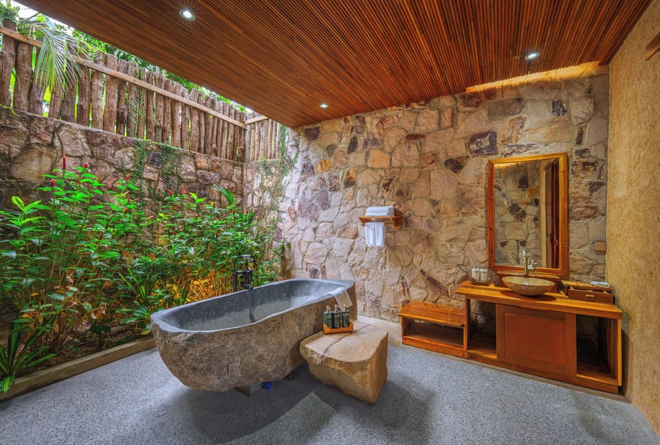 Premium Bungalow with Garden View | Bathroom | Deep soaking tub, rainfall showerhead, designer toiletries, hair dryer