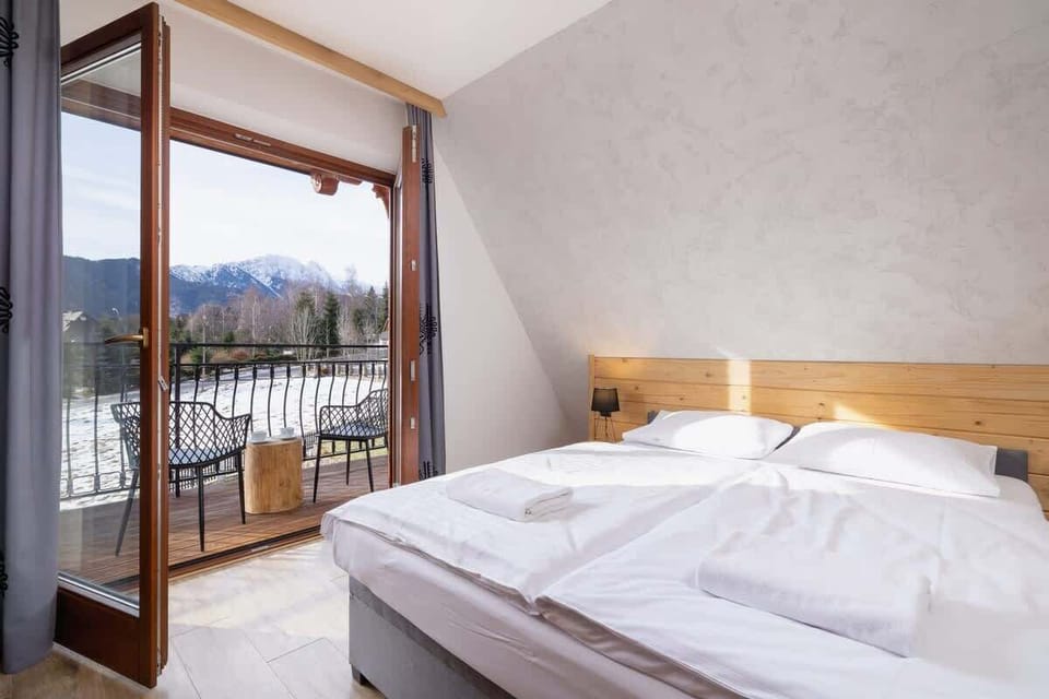 Bedroom with access to a spacious balcony.