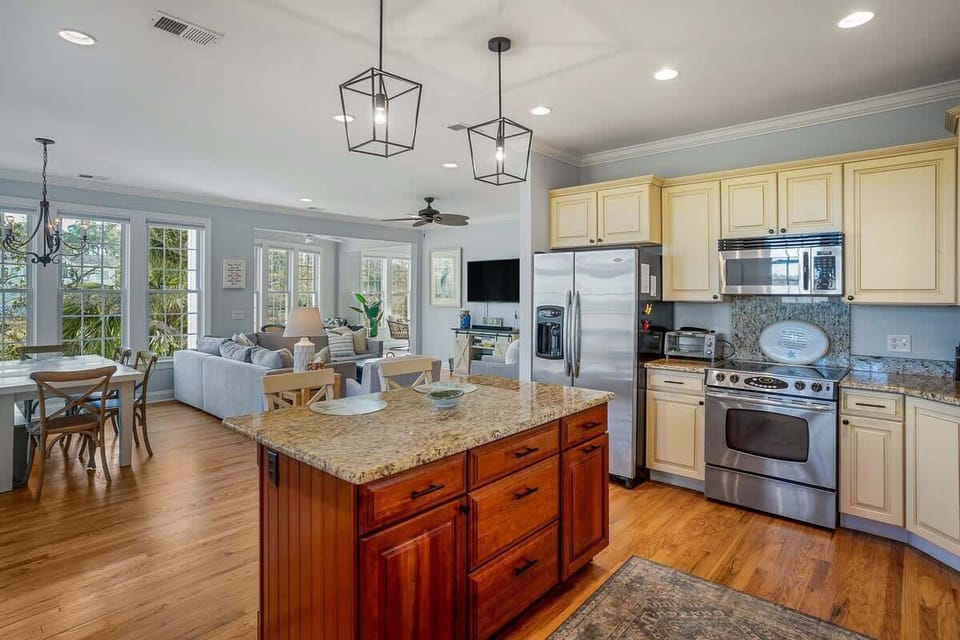 Updated Kitchen Comes with Stainless Steel Appliances—Including a Wine Cooler—and a Two-Seat Island