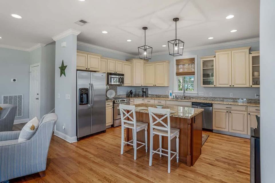 Updated Kitchen Comes with Stainless Steel Appliances—Including a Wine Cooler—and a Two-Seat Island