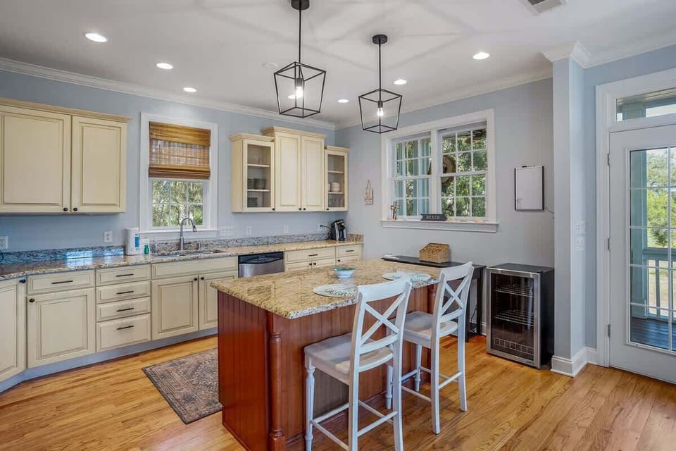 Updated Kitchen Comes with Stainless Steel Appliances—Including a Wine Cooler—and a Two-Seat Island