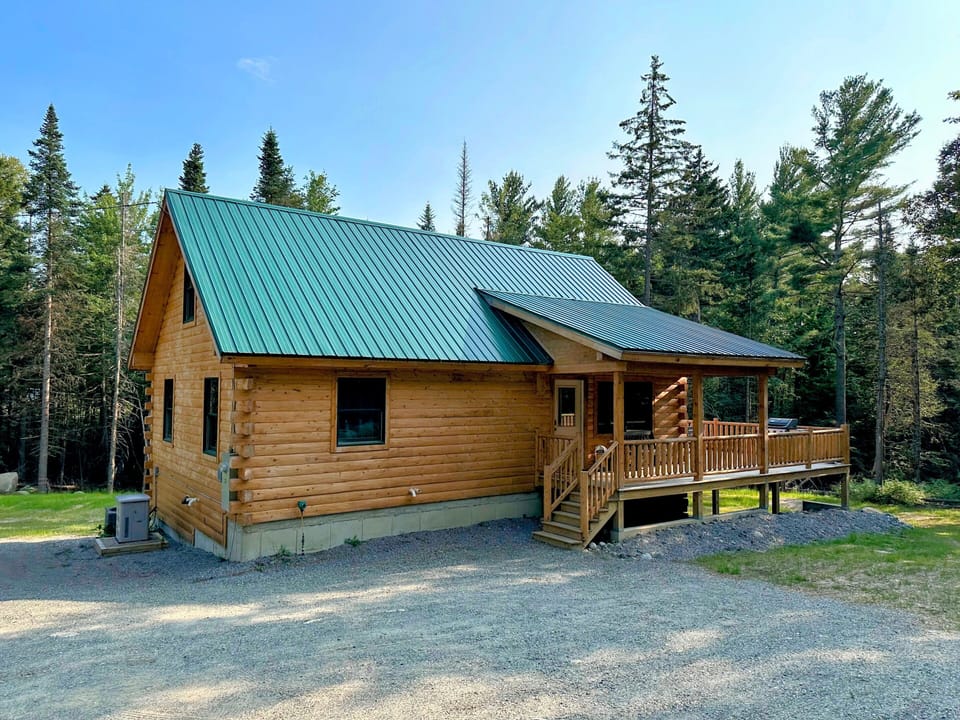 Escape to this charming, newly built log cabin, nestled in a private, wooded setting