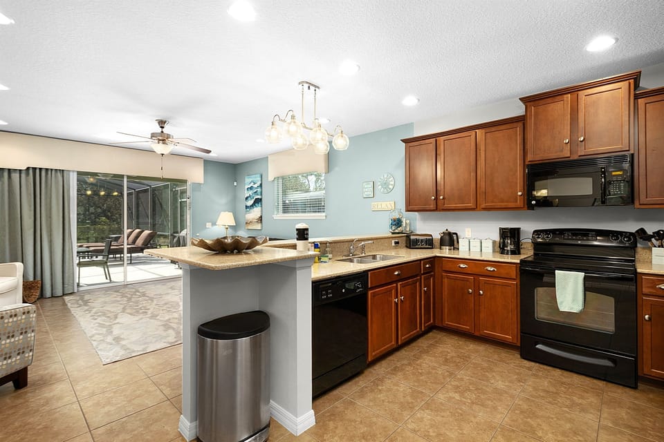 The fully equipped kitchen has a dishwasher, microwave and stove.