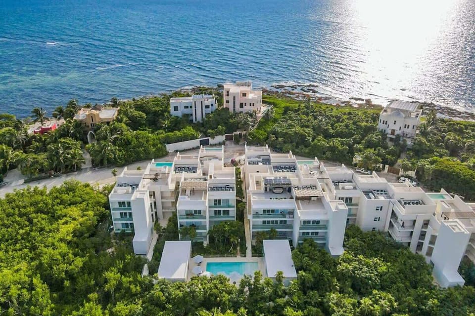 Surrounded by tropical greenery, just steps from the sea