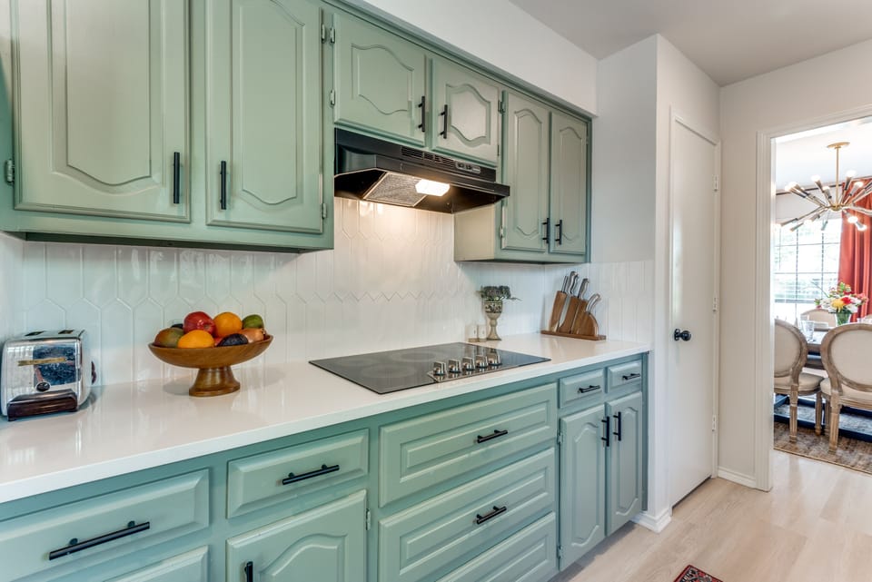 The charming galley-style kitchen is fully equipped for preparing food at home