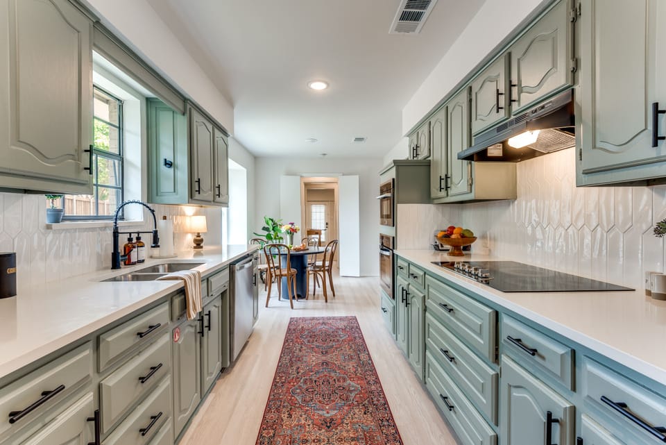 The fully stocked kitchen features all new stainless appliances 