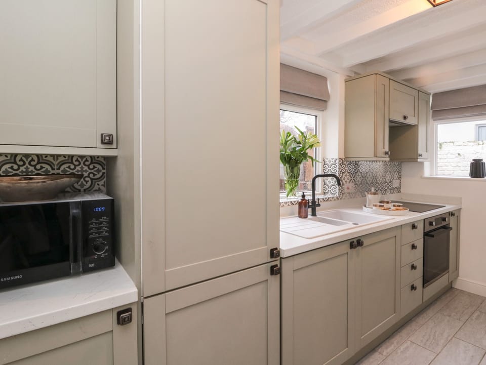 Fridge, electric kettle, cookware/dishes/utensils