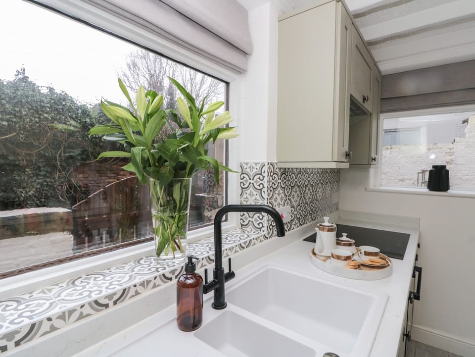 Fridge, electric kettle, cookware/dishes/utensils