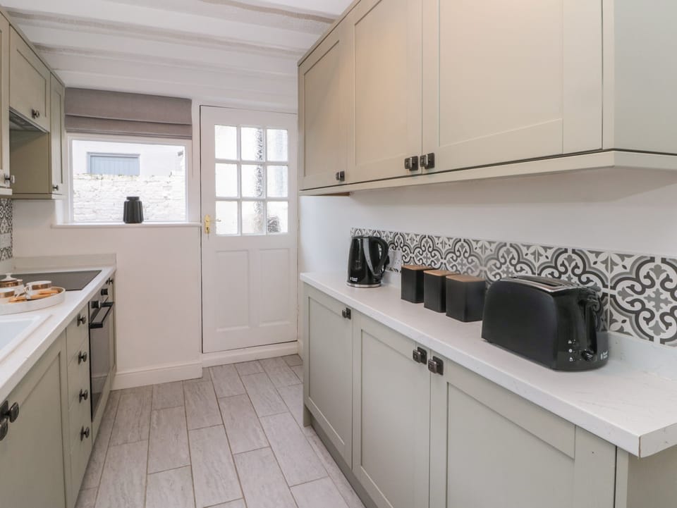 Fridge, electric kettle, cookware/dishes/utensils