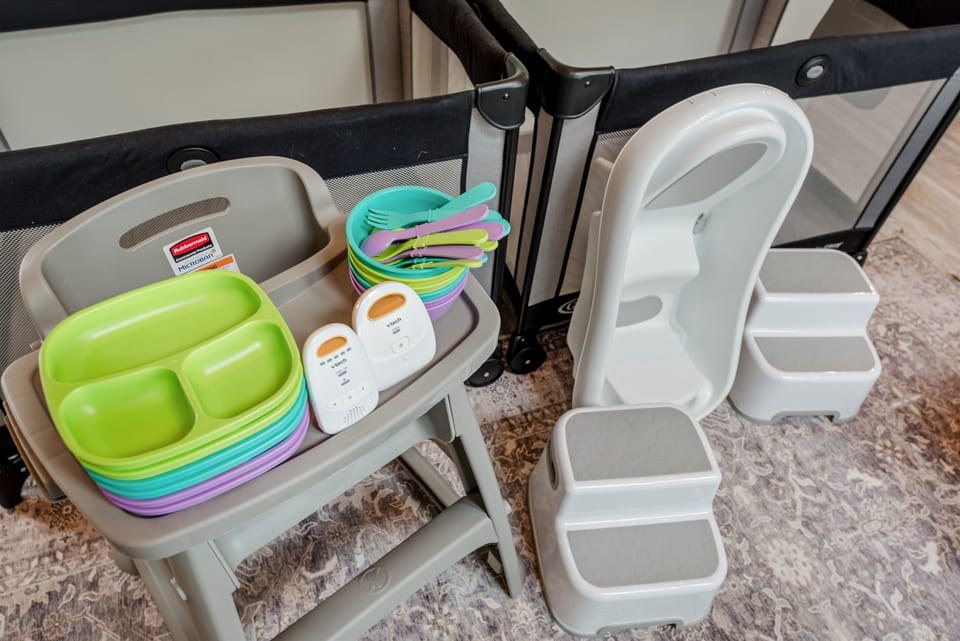 Leave the bulky kids' gear at home! You'll have *TWO* pack-n-play cribs, waterproof sheets, a baby monitor, a high chair, kids' dinnerware, step stools in all bathrooms, and an infant bathtub.