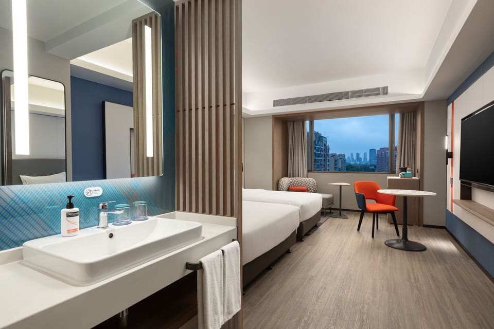 Premium bedding, down comforters, minibar, laptop workspace