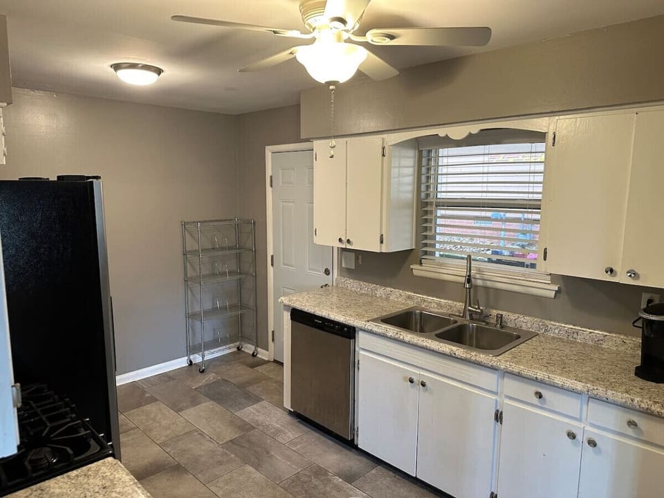 Bright kitchen with ample counter space & storage.