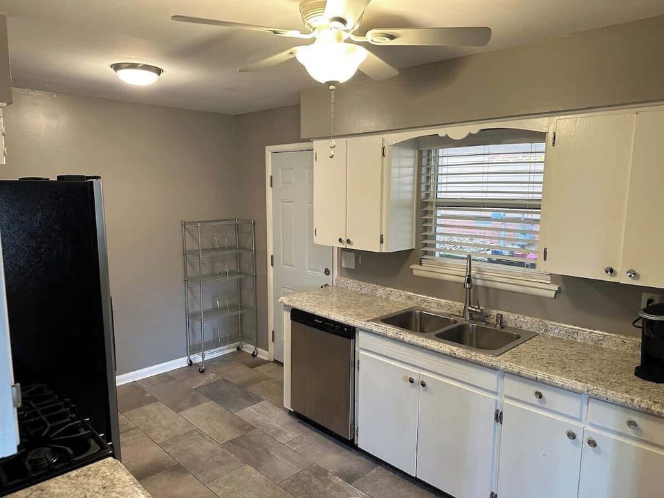 Bright kitchen with ample counter space & storage.