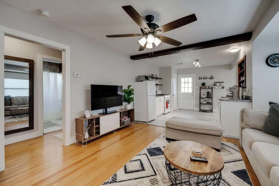 Cozy living area with a flat-screen TV, stylish décor, and plenty of space to relax after a day out.