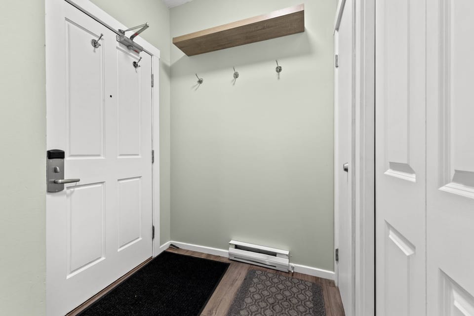 Entrance to the condo. Shelf for helmets and hooks for jackets and ski pants.