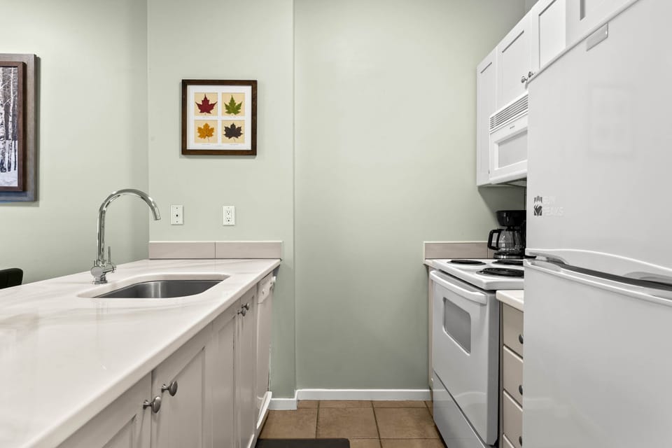 Cute and functional, the kitchen has a small dishwasher as well.