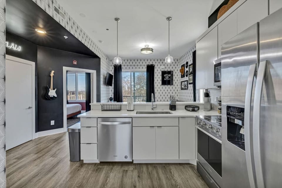 Modern kitchen with stainless steel appliances, fully stocked for all your cooking needs