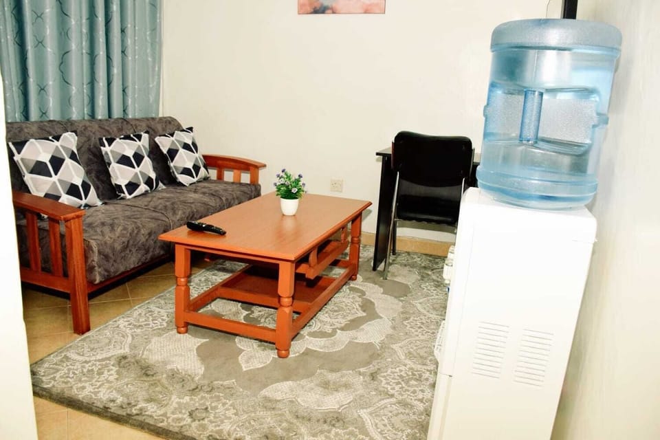 Business Apartment | Living area | 24-inch Smart TV with digital channels
