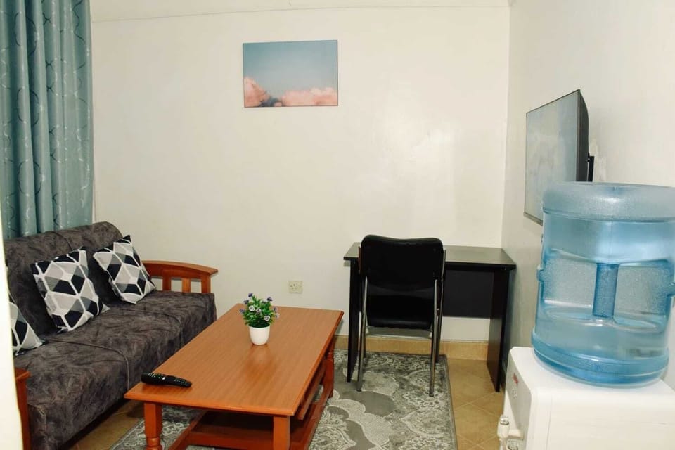 Business Apartment | Living area | 24-inch Smart TV with digital channels