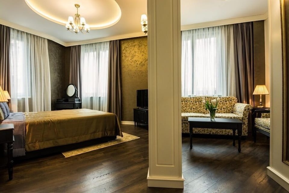 Superior Double Room | Living area | 50-inch Smart TV with cable channels