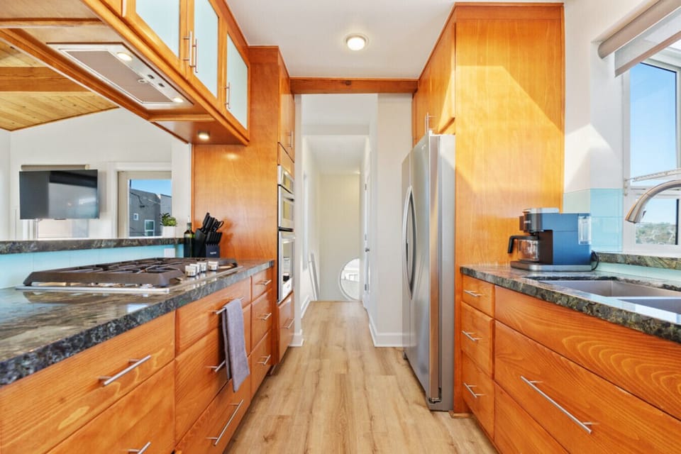 Savor the flavors of the coast in our fully stocked, stylish kitchen—where culinary inspiration meets sea views.