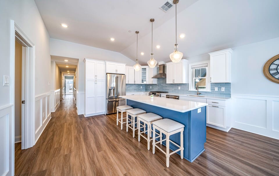 Sleek kitchen island with four bar stools