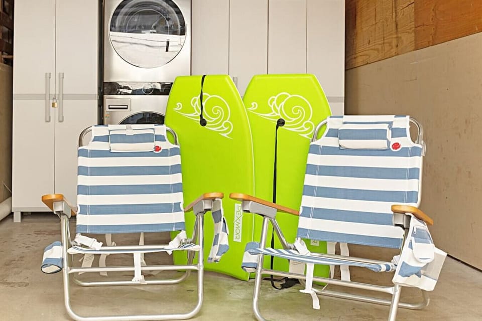 Enjoy your day at the beach with beach chairs, boogie boards, beach towels, and an umbrella.