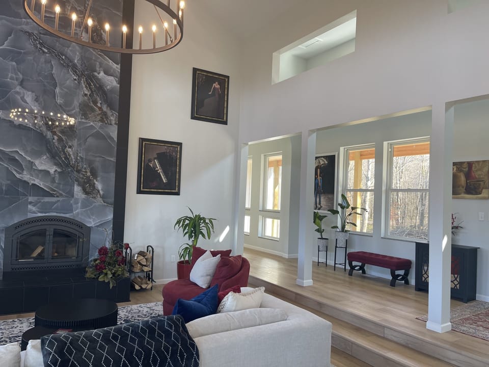 View of the wood burning fireplace and hallway north