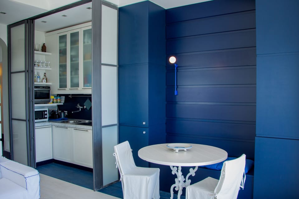 Exclusive Apartment | Living area | 42-inch flat-screen TV with digital channels