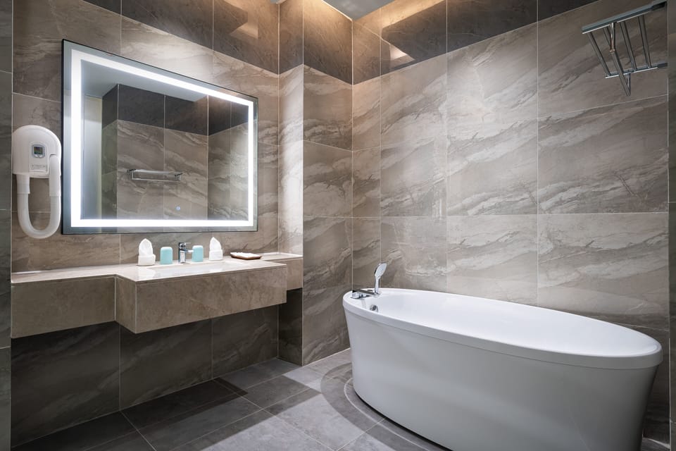 Exclusive Room | Bathroom | Combined shower/tub, deep soaking tub, free toiletries, hair dryer