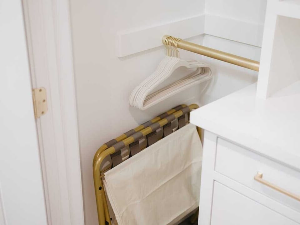 Bedroom 1 & 2: Each bedroom has a luggage rack located in the closet.