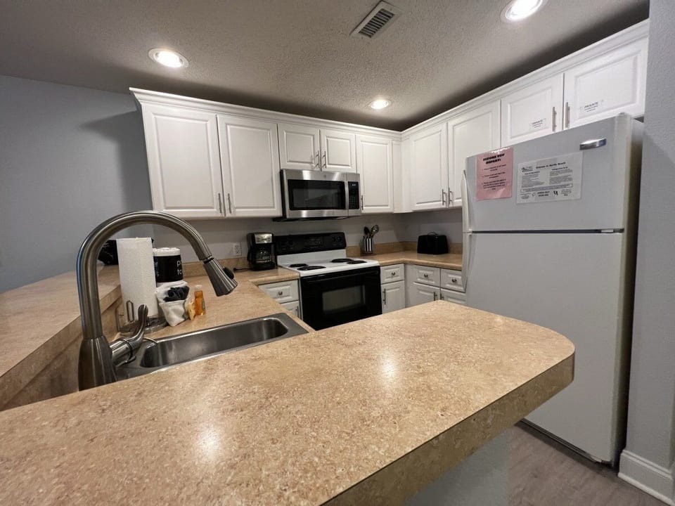Kitchen - Amenities Included to Enjoy Cooking from Your Home Away from Home