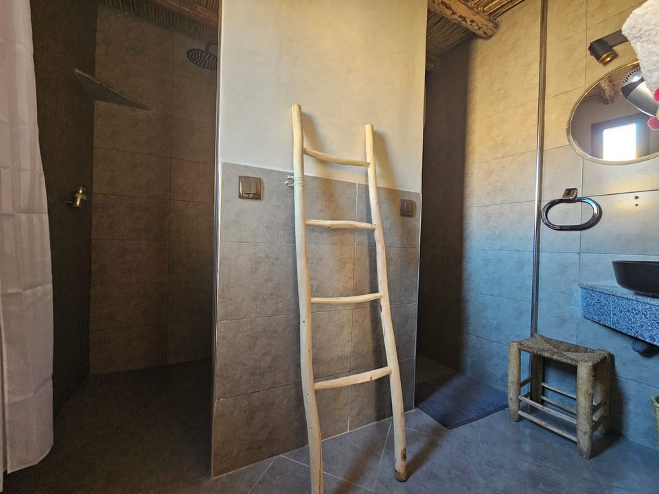 Shower, rainfall showerhead, hair dryer, towels