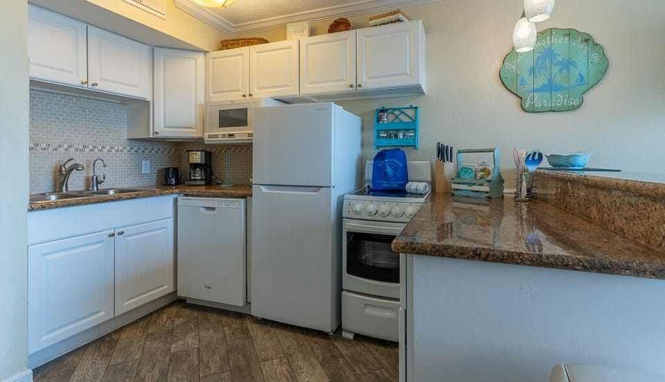 And exceptionally appointed kitchen with range, dishwasher, large fridge and microwave