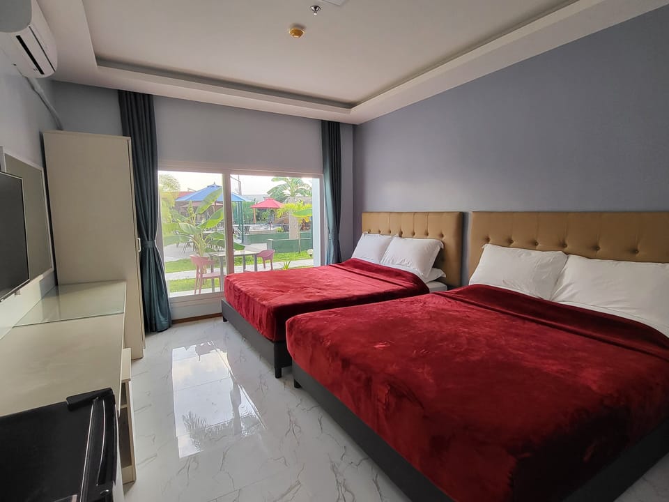 Family Quadruple Room | In-room safe, desk, laptop workspace, blackout drapes