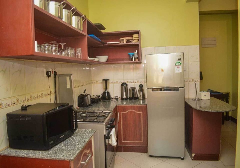 Family Apartment | Private kitchen | Fridge, microwave, cookware/dishes/utensils