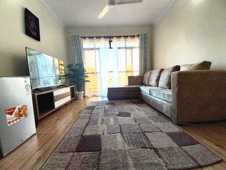 Business Apartment | Living area | 24-inch Smart TV with digital channels