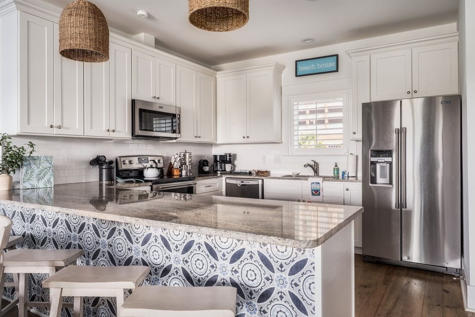 This bright kitchen is the heart of Blue Bungalow—fully stocked and ready for everything from breakfast at the bar to sunset snacks. You’ll love the light, the layout, and the ef