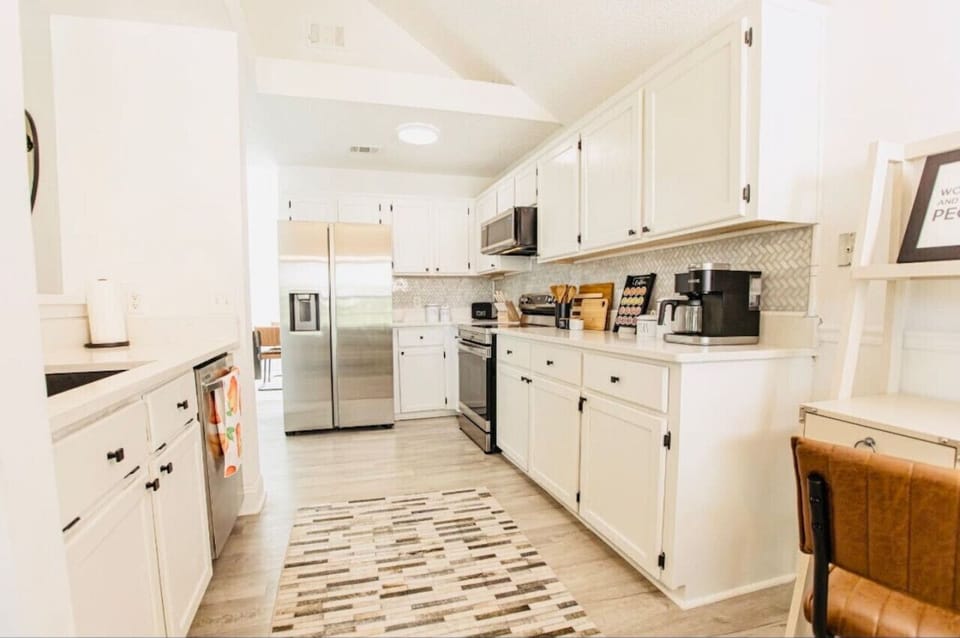 Bright and airy kitchen with ample counter space, modern appliances, and everything you need to prepare a delicious meal during your stay.
