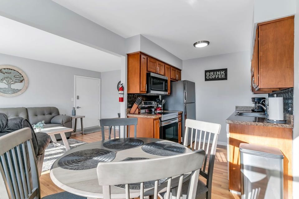Open concept living room into dining room & kitchen.