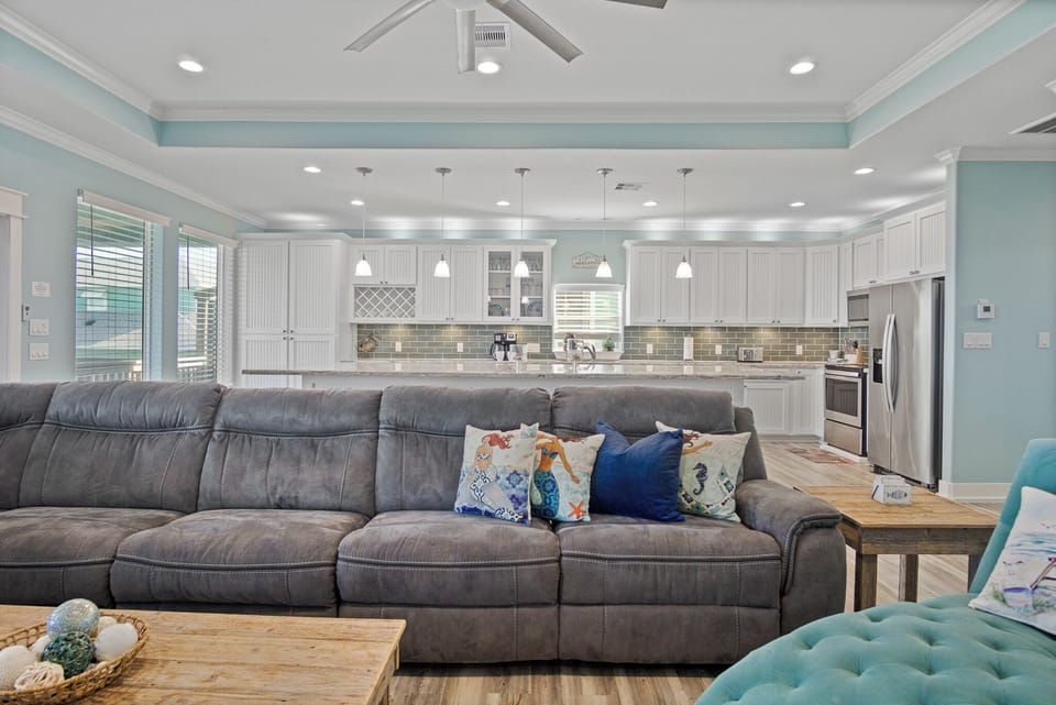 Feeling TipSea Living Room: Unwind in luxury in this coastal haven, where every detail is designed for your comfort and enjoyment. Relax on the velvet chaise or cozy up on the sectional sofa while watching your favorite shows on the SMART TV.