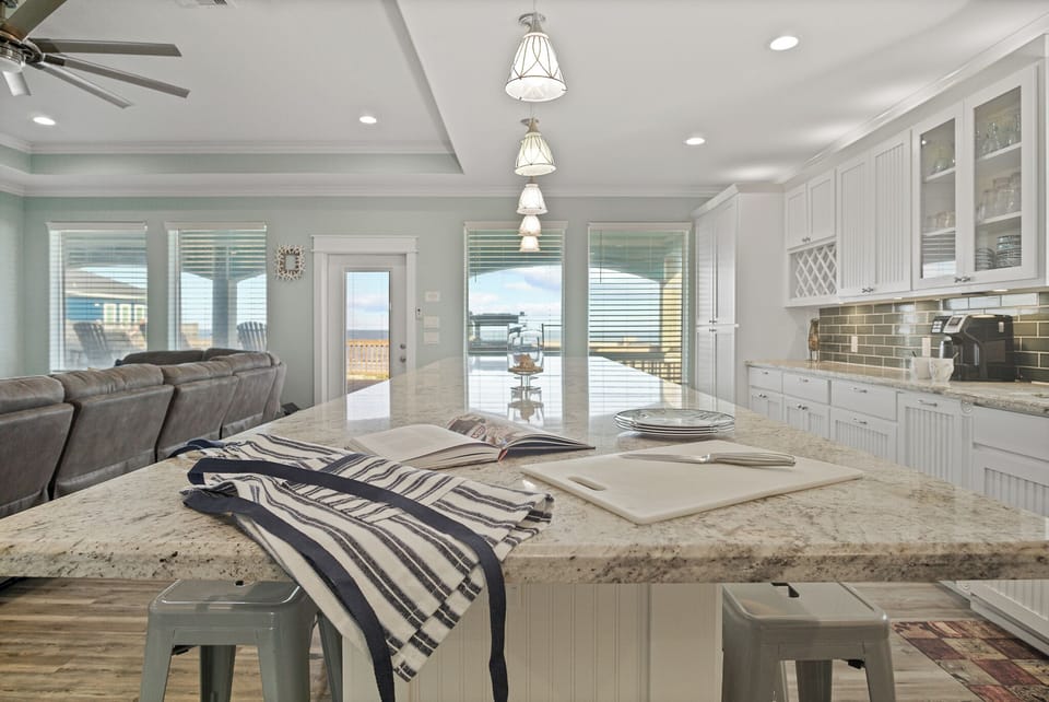 Feeling TipSea Kitchen: Retreat to your culinary oasis in this upscale kitchen, featuring designer finishes, such as brushed nickel hardware and handcrafted tile accents, creating a welcoming space to gather and savor the coastal lifestyle.