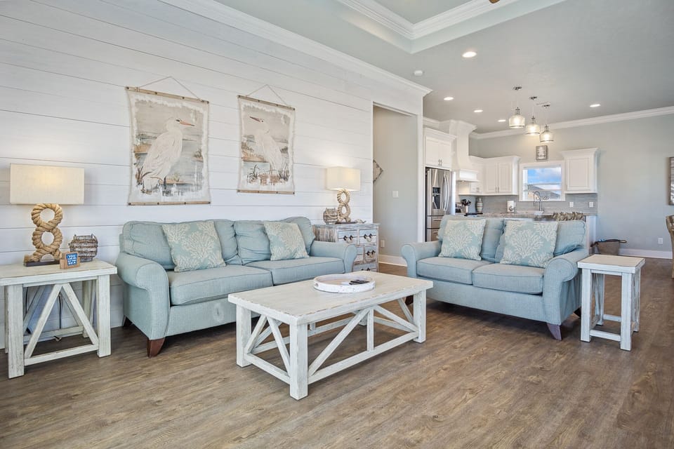 Pineapple Paradise Living Room: Discover coastal comfort in this inviting vacation rental, offering a perfect blend of style and functionality. 