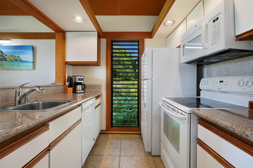 full kitchen with window.