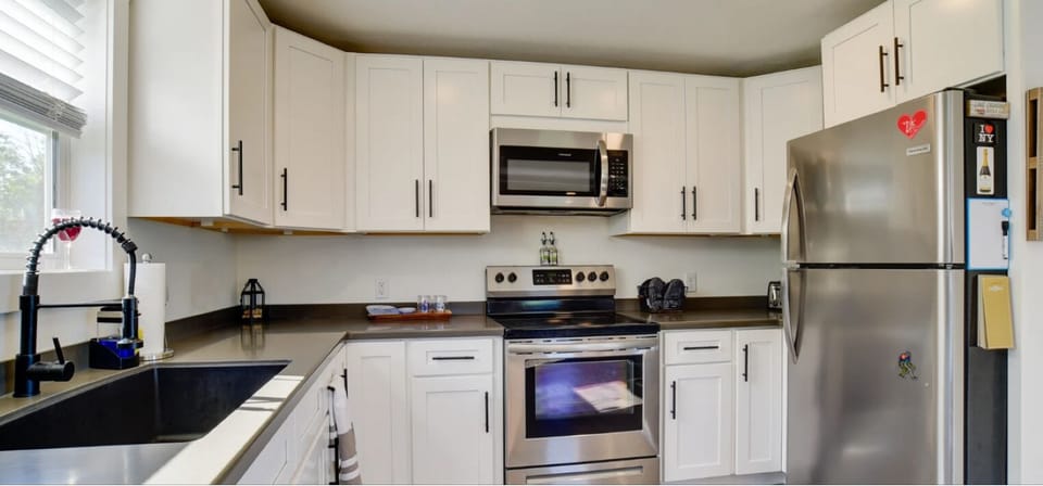 Fully stocked with cooking utensils, dishes, glassware, flatware and more. 