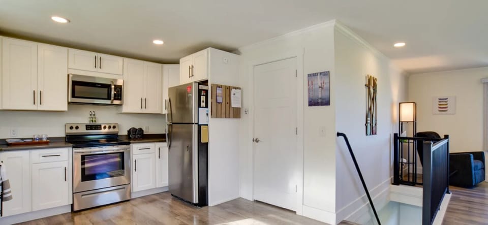 Door to master bedroom. Stairs to lower level family room and bedrooms. 