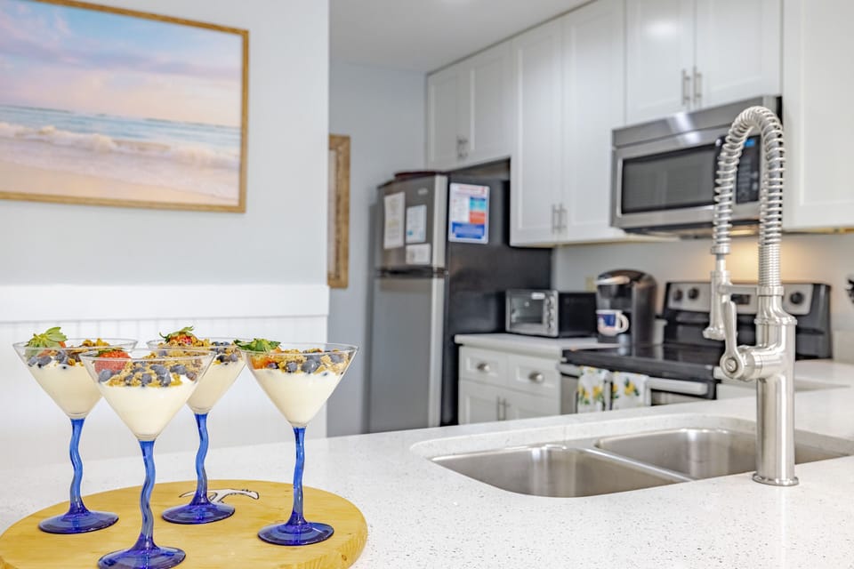 Fully stocked kitchen offers everything you will need for easy meal prep inside the condo.