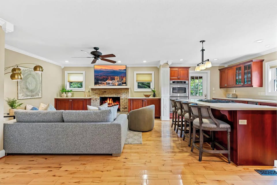 Open-concept living room with big-screen entertainment