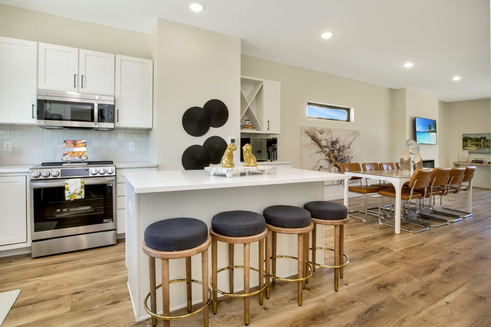 Quartz counters, stainless appliances, counter seating.